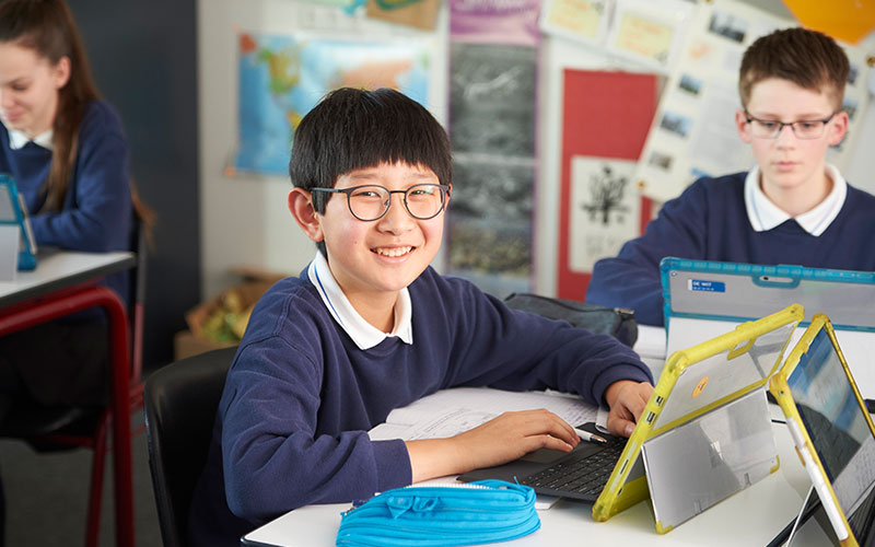 Boy in class with Surface Pro